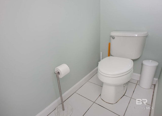 bathroom with toilet and tile patterned flooring