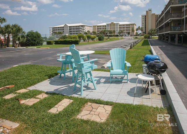 view of patio with a balcony and grilling area