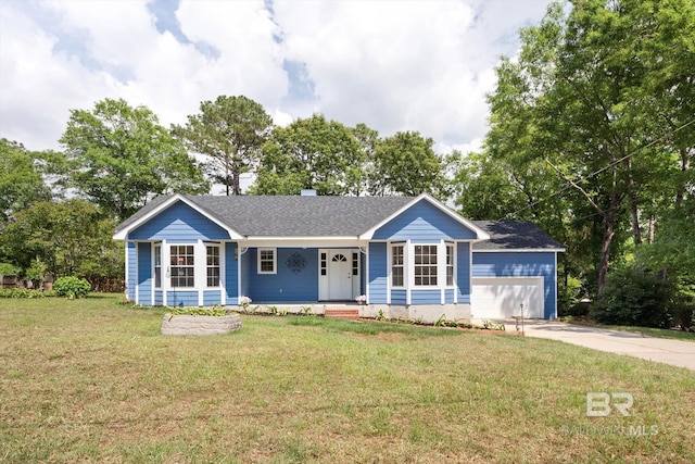 ranch-style home featuring covered porch, an attached garage, concrete driveway, a front lawn, and roof with shingles