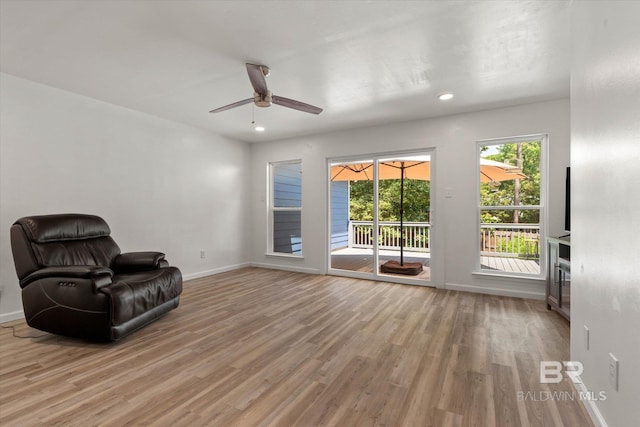 unfurnished room with baseboards, recessed lighting, ceiling fan, and wood finished floors