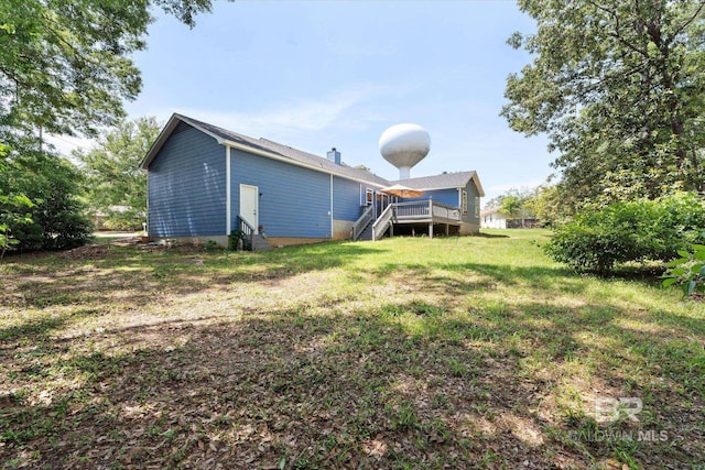 view of yard featuring a deck and stairway