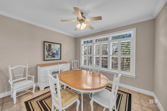 dining area with baseboards, ceiling fan, light tile patterned floors, and ornamental molding