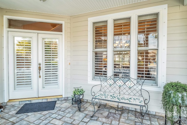 doorway to property featuring a porch