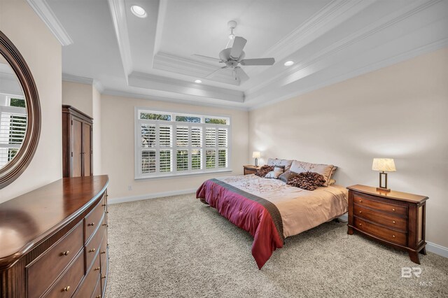 carpeted bedroom featuring a raised ceiling, crown molding, baseboards, and recessed lighting