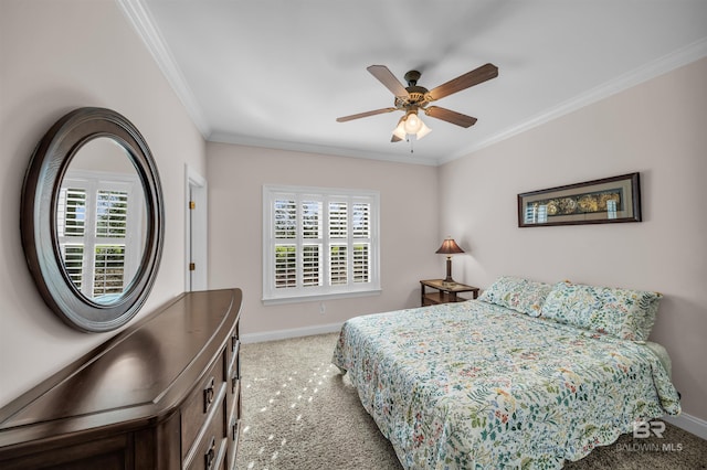 bedroom with baseboards, ornamental molding, ceiling fan, and carpet