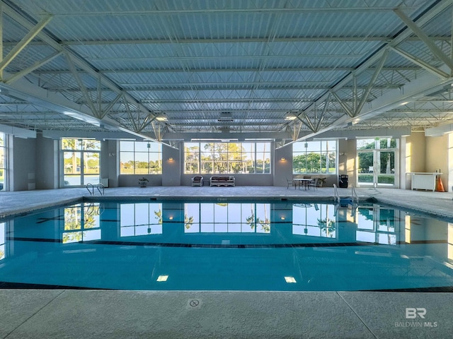 pool featuring a lanai and a patio area