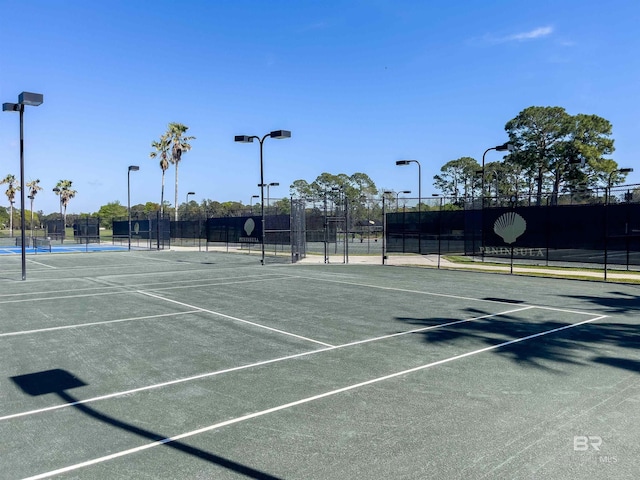 view of sport court with fence