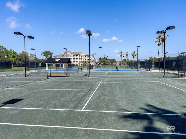 view of sport court with fence