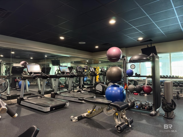 gym featuring a drop ceiling and visible vents