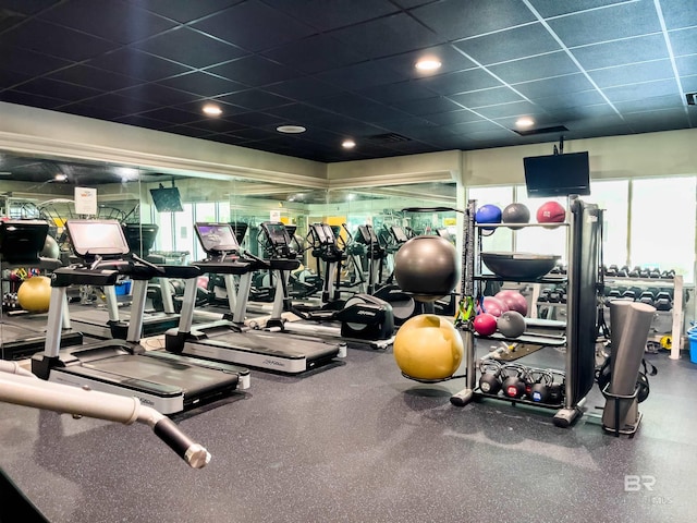 gym featuring a drop ceiling