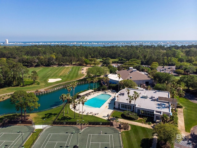 bird's eye view with a water view and a wooded view