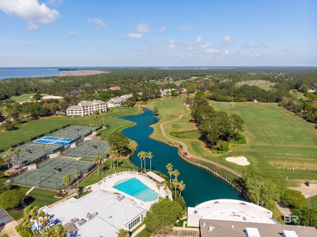 birds eye view of property featuring golf course view and a water view