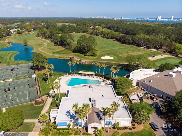 birds eye view of property featuring view of golf course and a water view