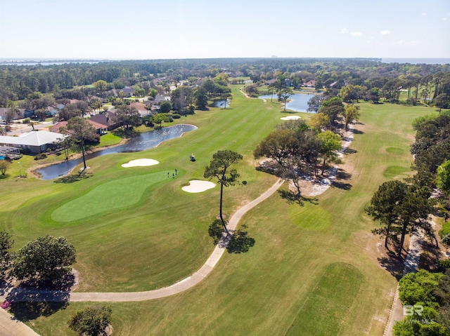 bird's eye view with a water view and view of golf course