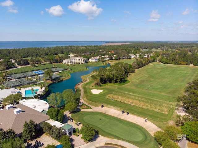 aerial view with a water view and view of golf course