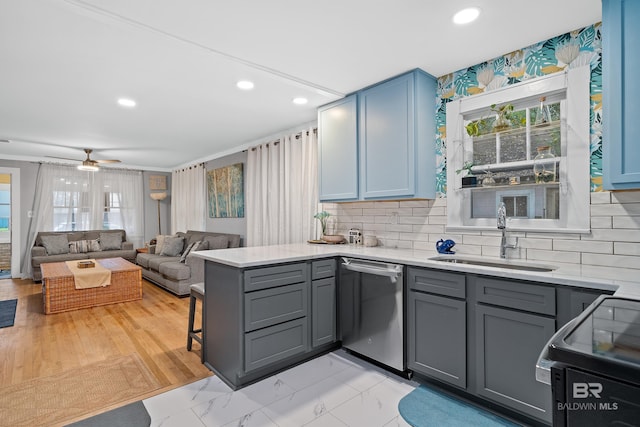 kitchen with gray cabinets, black electric range oven, a sink, dishwasher, and a peninsula