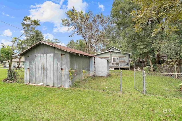 exterior space with an outbuilding and fence