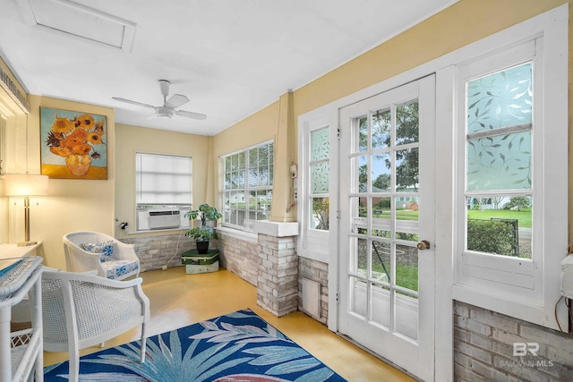 sunroom / solarium featuring cooling unit and a healthy amount of sunlight