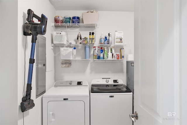 clothes washing area featuring laundry area and washing machine and clothes dryer