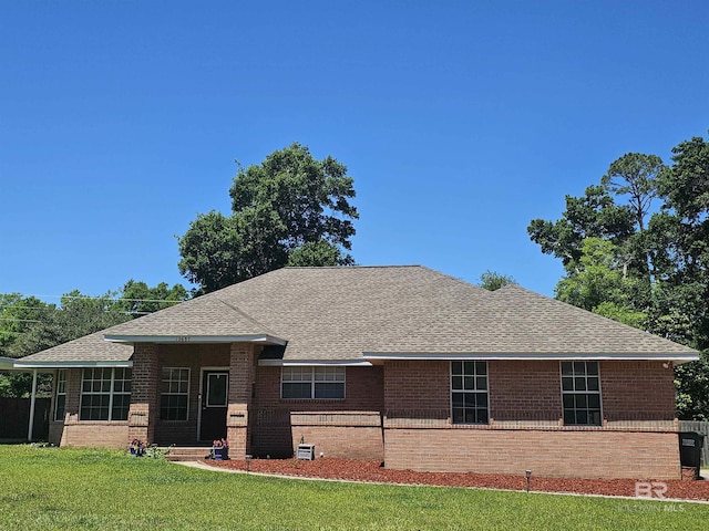 10687 Magnolia Ln, Lillian, AL 36549 - view of front of home featuring brick siding, roof with shingles, and a front lawn