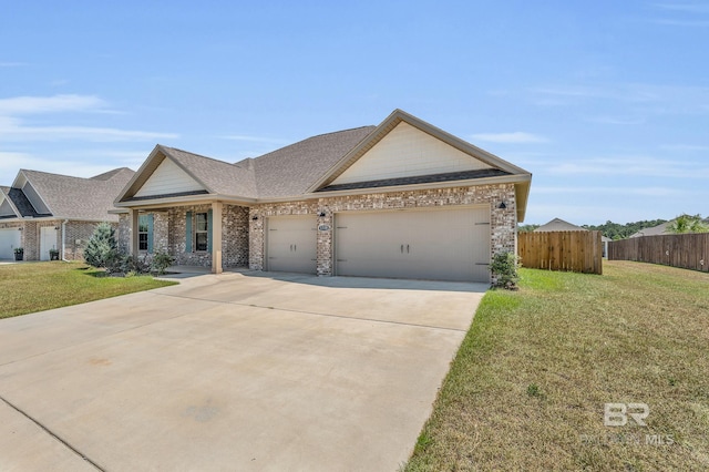 view of front of home featuring an attached garage, brick siding, fence, driveway, and a front yard