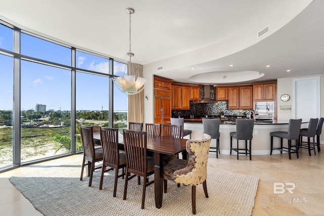 dining space with recessed lighting, floor to ceiling windows, visible vents, and light tile patterned floors