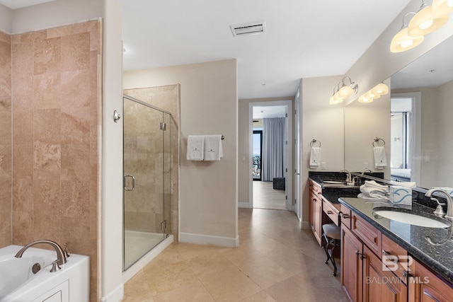 full bath with a stall shower, visible vents, and a sink