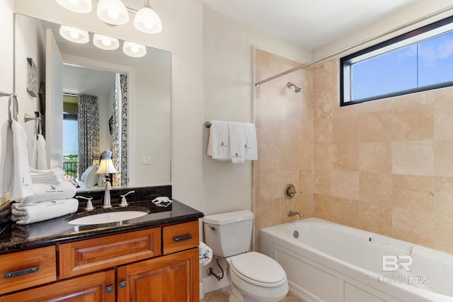 bathroom featuring shower / tub combination, vanity, and toilet