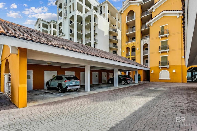 view of building exterior featuring covered parking