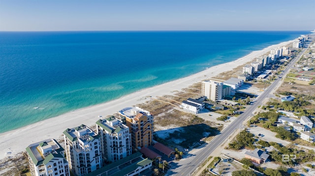 aerial view featuring a water view and a beach view