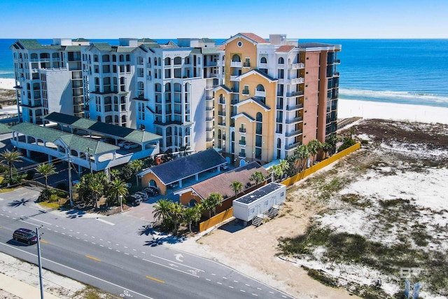 aerial view with a water view and a view of the beach