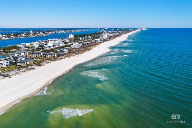 bird's eye view featuring a water view and a view of the beach