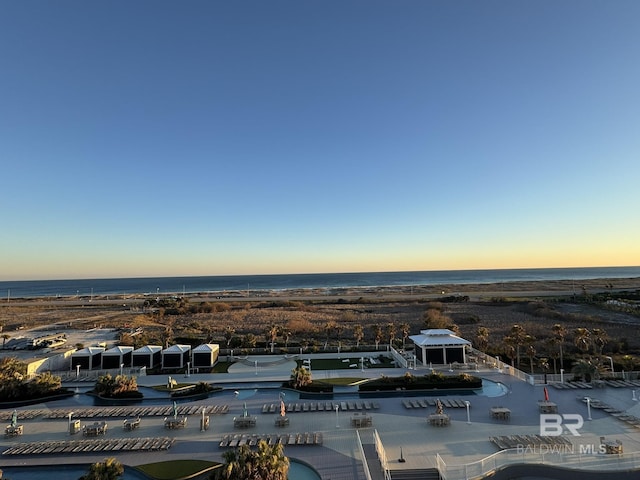 aerial view at dusk with a water view