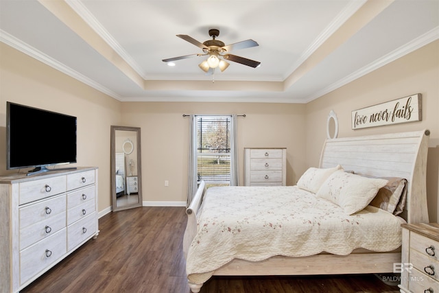 bedroom with dark hardwood / wood-style flooring, a raised ceiling, ceiling fan, and ornamental molding