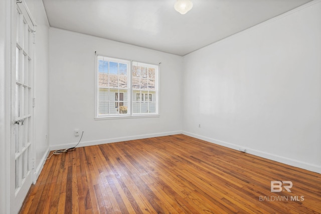 unfurnished bedroom featuring baseboards and wood-type flooring