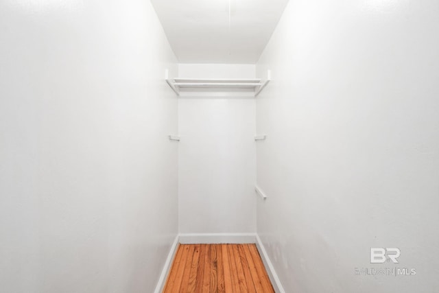 spacious closet with wood finished floors