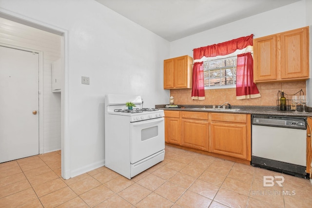 kitchen featuring white appliances, light tile patterned flooring, a sink, decorative backsplash, and dark countertops