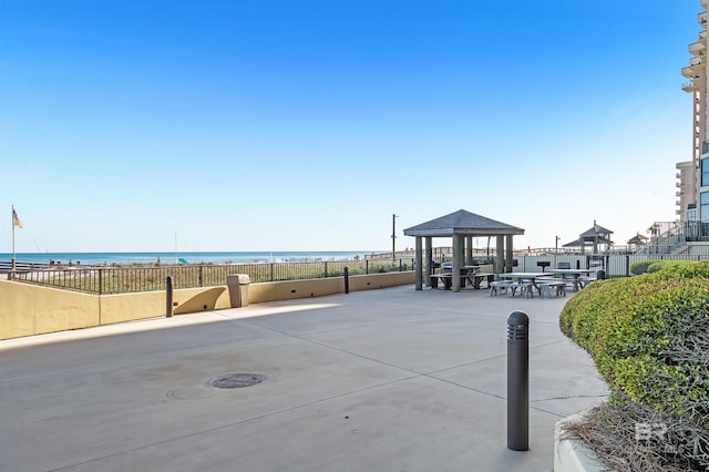 24230 Perdido Beach Blvd Unit 3077, Orange Beach, AL 36561 - view of patio / terrace with a water view, a gazebo, a beach view, and fence