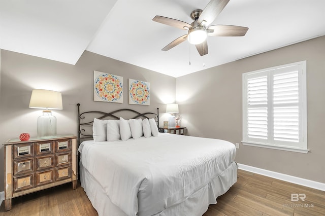 24230 Perdido Beach Blvd Unit 3077, Orange Beach, AL 36561 - bedroom with wood finished floors, ceiling fan, and baseboards