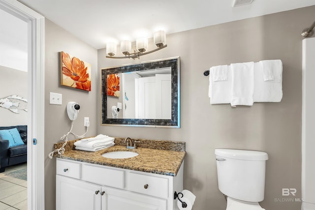24230 Perdido Beach Blvd Unit 3077, Orange Beach, AL 36561 - ensuite bathroom with visible vents, toilet, connected bathroom, vanity, and tile patterned floors