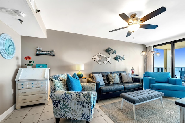 24230 Perdido Beach Blvd Unit 3077, Orange Beach, AL 36561 - living area with ceiling fan, baseboards, light tile patterned floors, and expansive windows