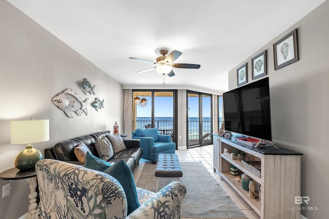 24230 Perdido Beach Blvd Unit 3077, Orange Beach, AL 36561 - living room with a wall of windows, light tile patterned flooring, and ceiling fan