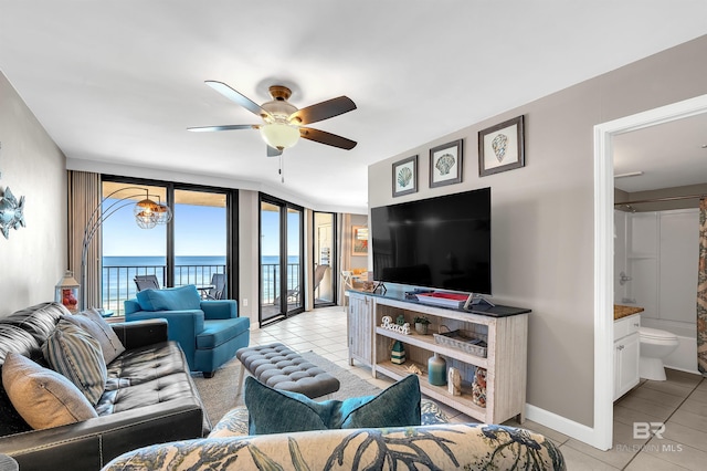 24230 Perdido Beach Blvd Unit 3077, Orange Beach, AL 36561 - living room with baseboards, a ceiling fan, and light tile patterned flooring
