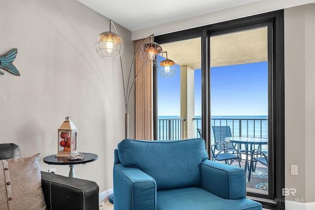 24230 Perdido Beach Blvd Unit 3077, Orange Beach, AL 36561 - living area featuring a water view and baseboards