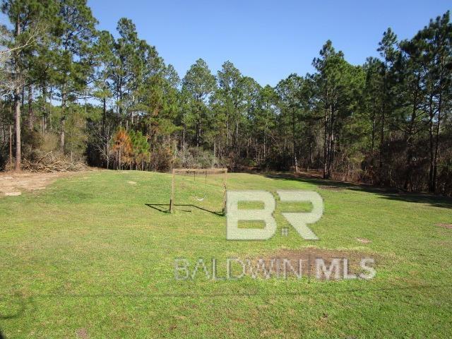 surrounding community featuring a yard