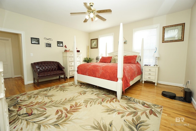 bedroom with hardwood / wood-style flooring and ceiling fan