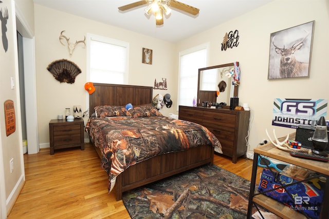 bedroom featuring light wood-type flooring and ceiling fan