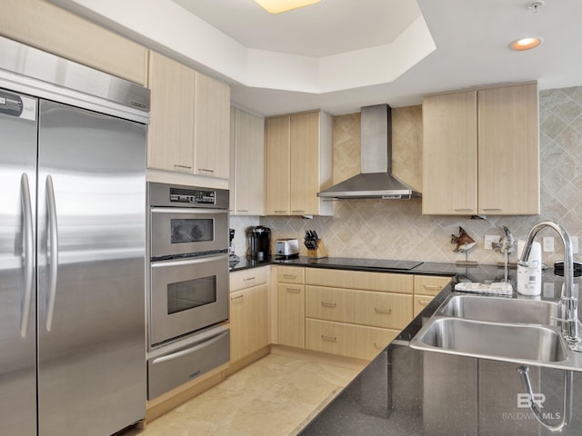 28105 Perdido Beach Blvd Unit C504, Orange Beach, AL 36561 - kitchen featuring wall chimney exhaust hood, light brown cabinetry, and stainless steel appliances