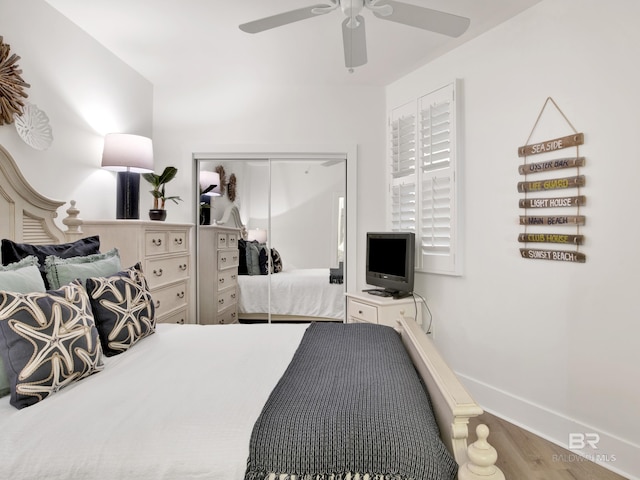 28105 Perdido Beach Blvd Unit C504, Orange Beach, AL 36561 - bedroom featuring baseboards, a ceiling fan, wood finished floors, and a closet