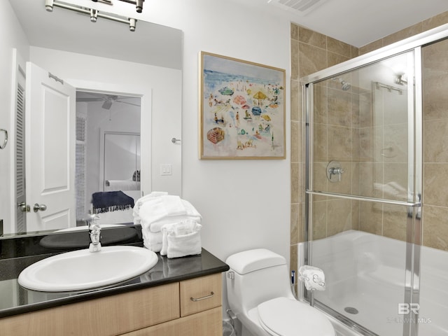 28105 Perdido Beach Blvd Unit C504, Orange Beach, AL 36561 - full bath with a ceiling fan, a stall shower, vanity, toilet, and visible vents